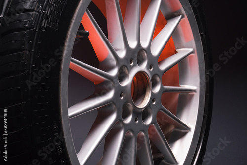 old car wheels titanium rims long exposure video on dark background spinning motion simulation