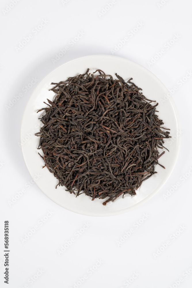 Fototapeta premium Black tea top view on white background