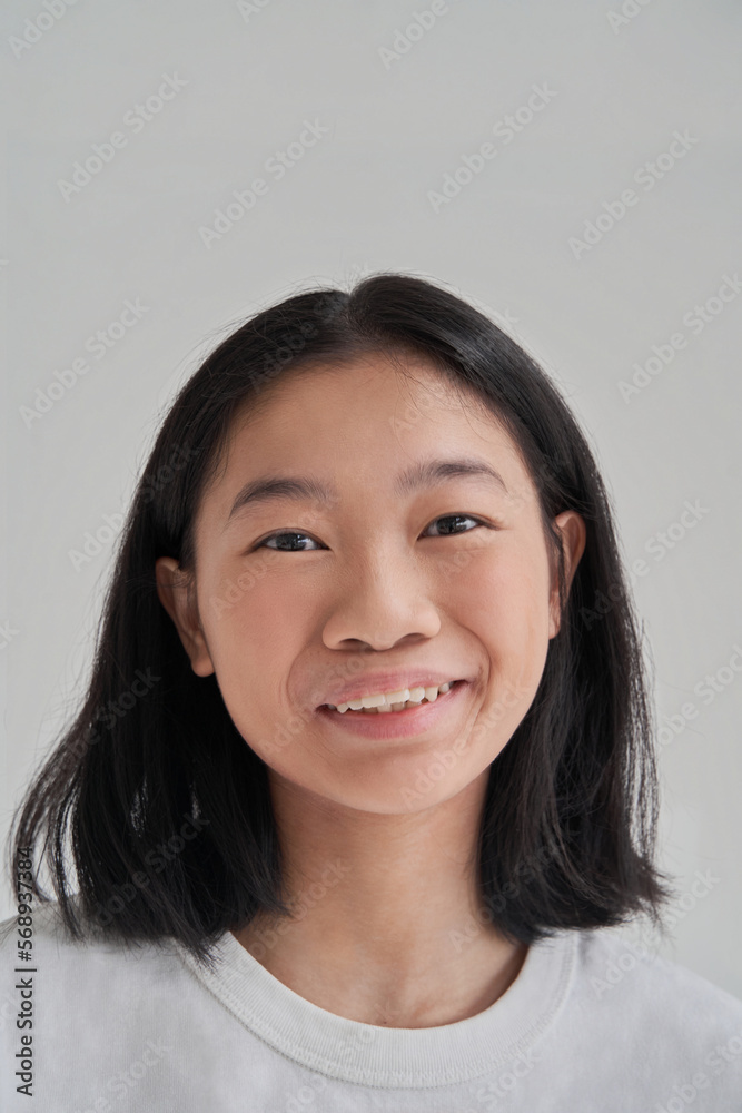 Cheerful Asian woman looking at camera Cheerful Asian woman looking at camera