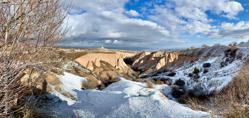 sunset landscape at sunset valley viewpoint in snowy Cappadocia, Nevsehir, Turkey