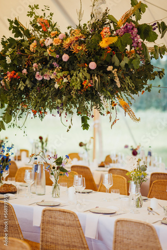 Tent Wedding Reception Venue Details with loth of flowers photo