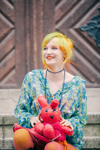 Woman holding a toy photo