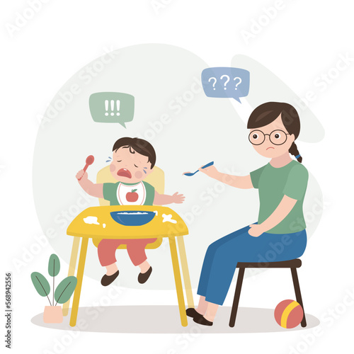 Mother or nanny trying to feed small child. Baby is crying and refuses to eat. Childhood, child care, difficulties and problems in raising young children. Calm mom holds spoon with food.