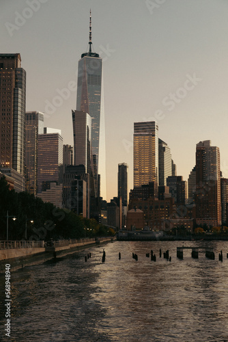 Skyscraper and buildings of World Trade Center during sunset in New York City.