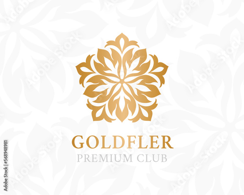 Gold ornamental logo. Floral design element. © KsanaGraphica