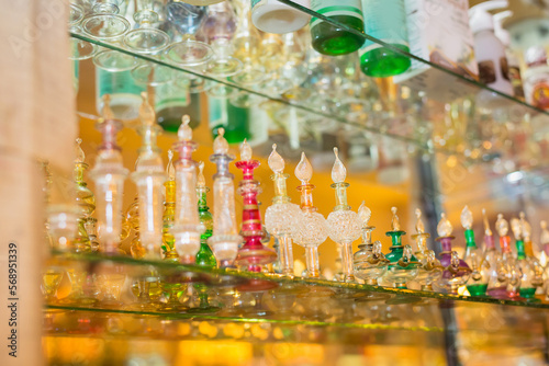 Glass perfume bottles based oils on Bazaar, market. Aroma, perfume essential oils in glass vessels.