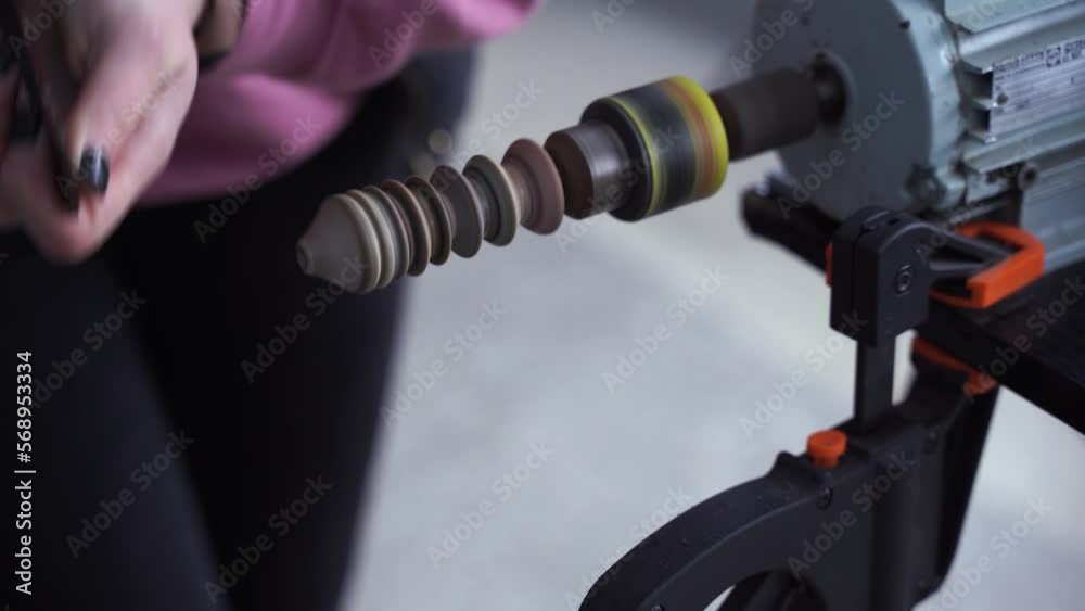 4k video Craftsman is grinding and polishing sides of genuine leather product on polishing machine. Production process of genuine leather products. 4k video Craftsman is grinding and polishing sides of genuine leather product on polishing machine. Production process of genuine leather products.