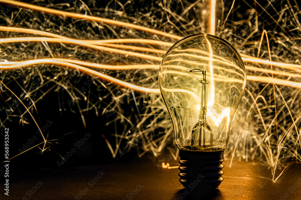 Lamp with fire sparks in a black background