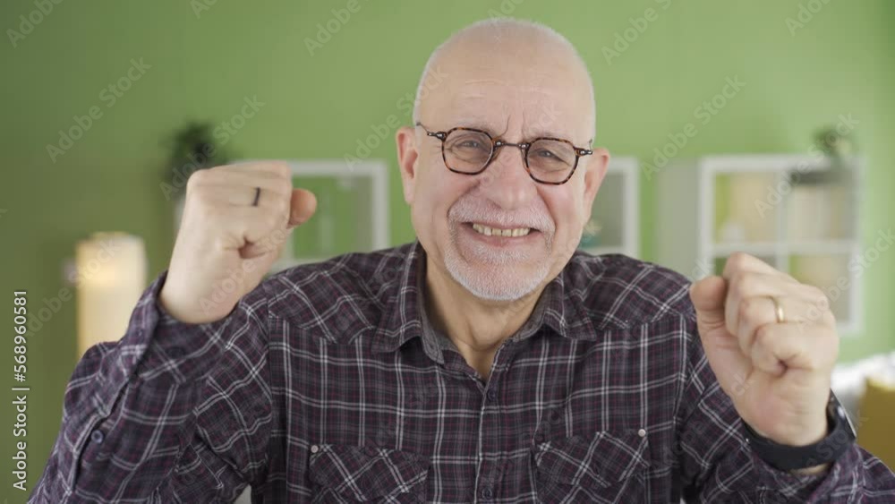Cheerful old man rejoices at home looking at camera.
Cute and happy old man looking at camera at home rejoicing at the good news he has received.
Cheerful old man rejoices at home looking at camera.
Cute and happy old man looking at camera at home rejoicing at the good news he has received.