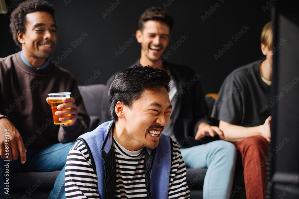 Young Men Watching Match at Home Young Men Watching Match at Home
