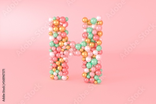 Letter H made of glass balls, pastel pearls, crystal jewels and gold. photo