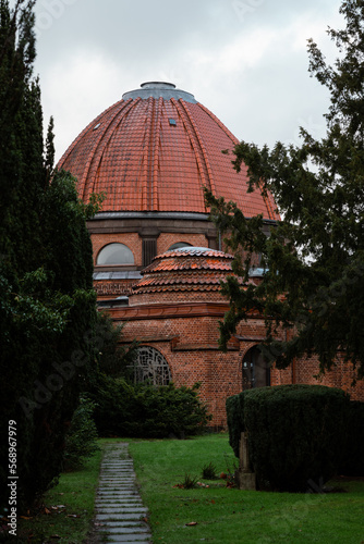 Vertical shot of traditional red brick building dansekapellet in Bispebjerg Kirkegaard in Copenhagen Denmark
