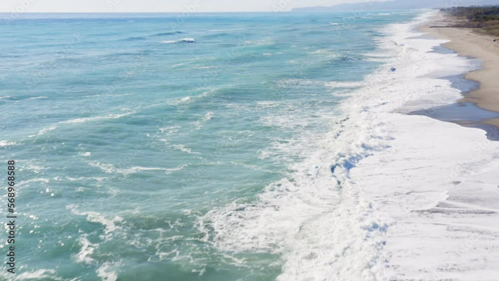 Stormy waves of Ocean in sunny daylight Stormy waves of Ocean in sunny daylight