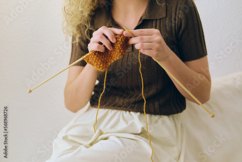 Closeup of a woman knitting photo