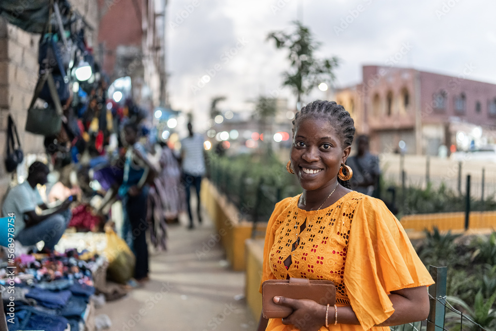 © Alvaro Lavin/Stocksy - portrait of woman in african street © Alvaro Lavin/Stocksy - portrait of woman in african street