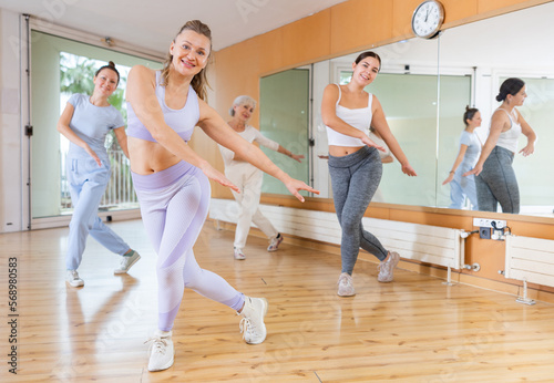 Dance class for adult people, positive women training in dance studio