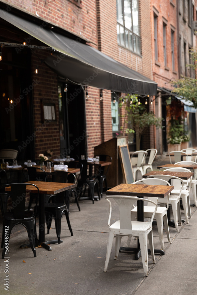 Outdoor cafe on urban street in New York City.