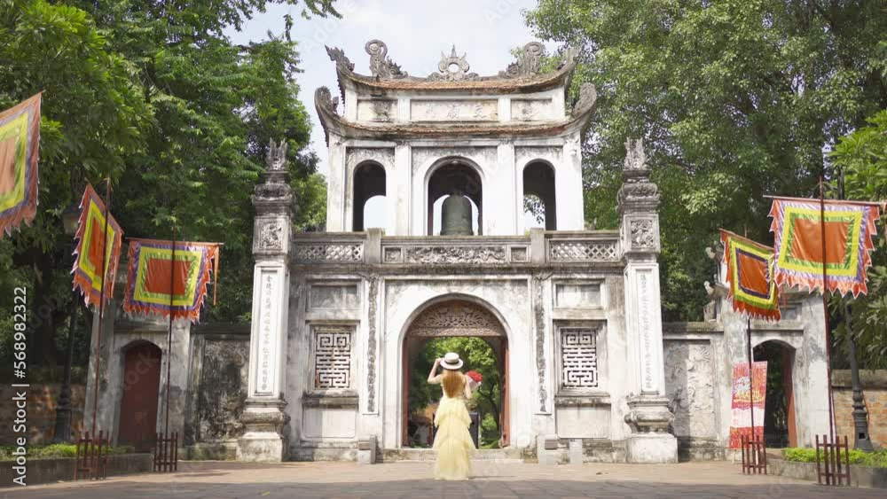 Portrait of Asian Vietnamese woman girl in local temple traveling in Hanoi urban city town, Vietnam. People lifestyle. Portrait of Asian Vietnamese woman girl in local temple traveling in Hanoi urban city town, Vietnam. People lifestyle.