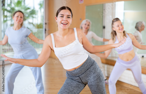 Dance class for adult people, positive women training in dance studio © JackF
