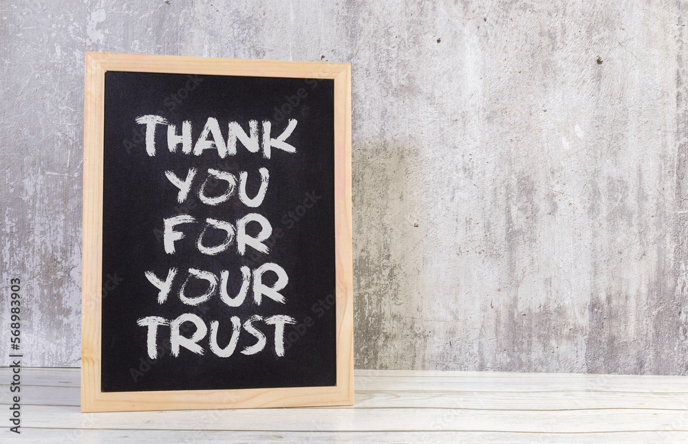 Thank you for your trust written on a blackboard