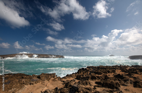 View of storm surf waves crashing into Laie Point rocky coastline at Kaawa on the North Shore of Oahu Hawaii United States photo