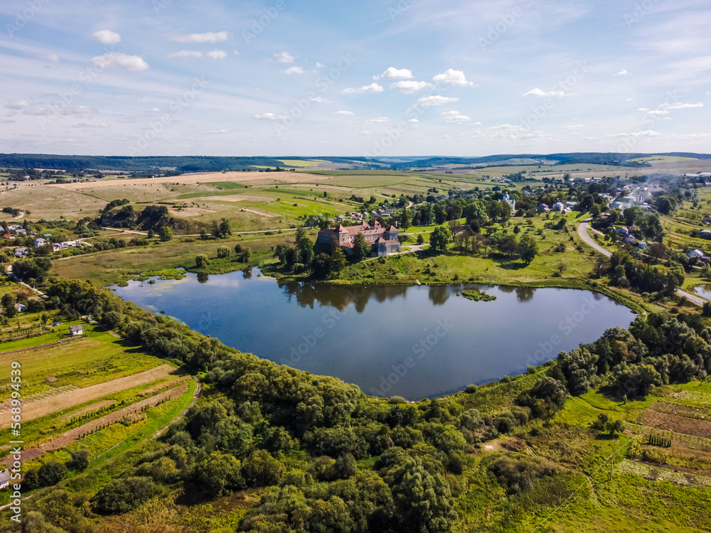 Aerial view by drone. Summer. Svirzh Castle
Ukraine Castles. Lakes.
