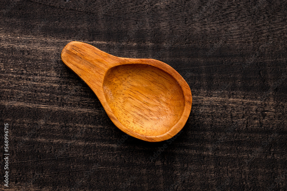 wooden spoon on dark rustic table - Kitchen accessory wooden spoon on dark rustic table - Kitchen accessory