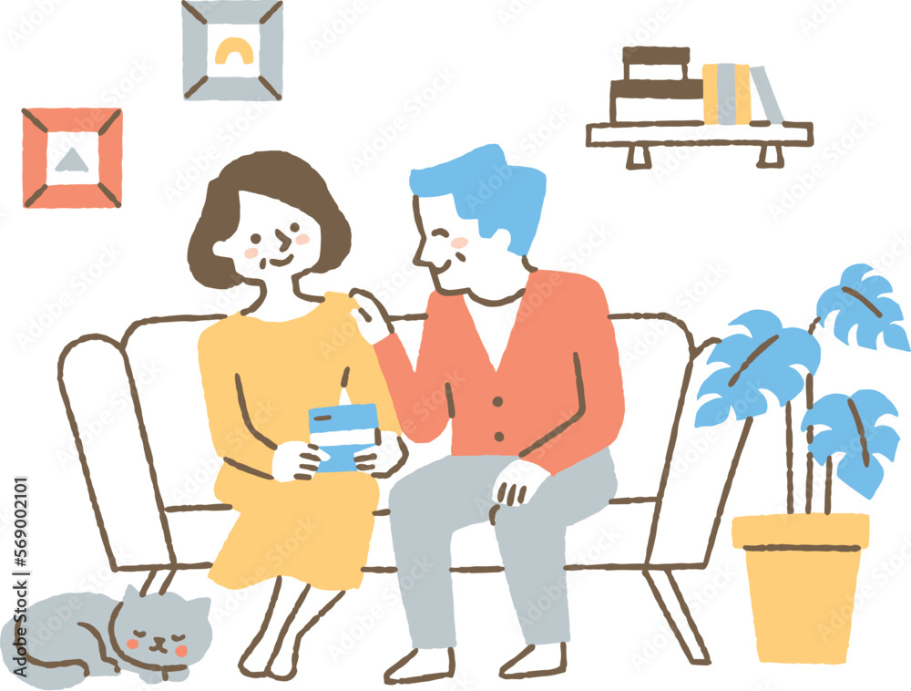 通帳を見て微笑む夫婦_色