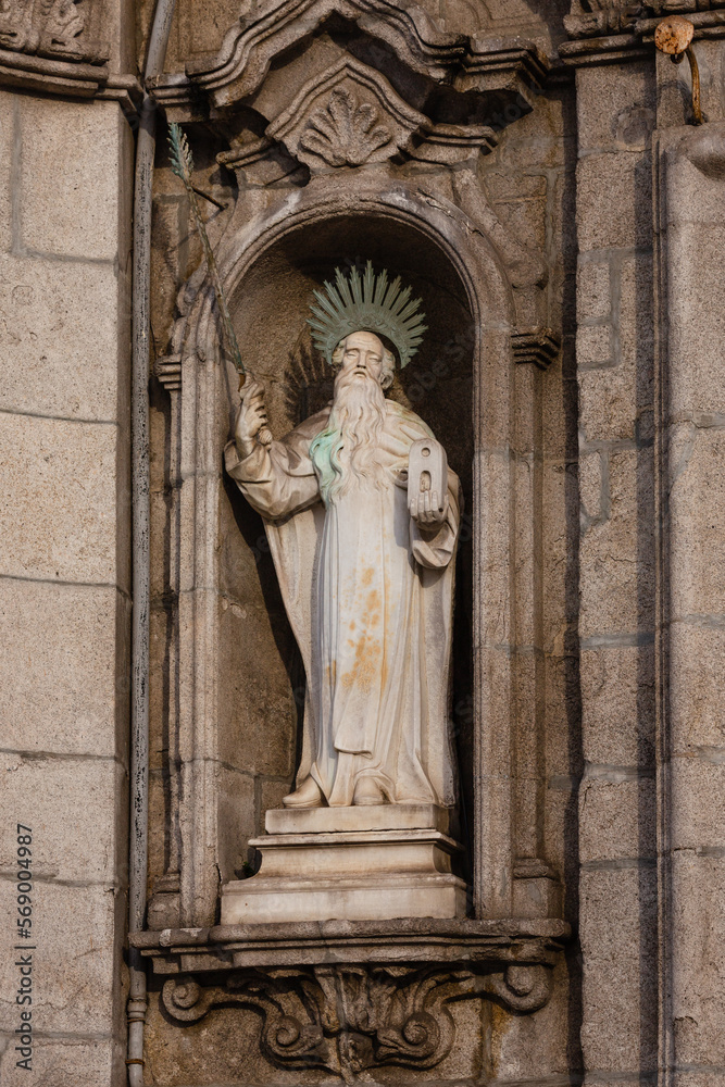 One of many sculptures on the facade of Igreja do Carmo