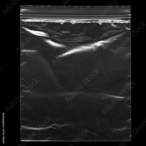 Wrinkled plastic wrap with zipper texture on a black background wallpaper. Royalty high-quality free stock photo image of realistic plastic wrap for overlay. Wrinkled plastic surface