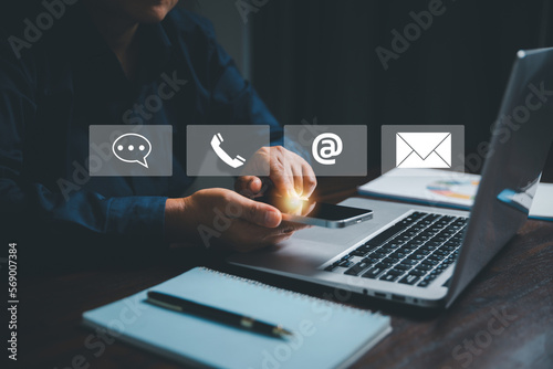 Customer support hotline contact us people connection concept. Web page online customer service technology idea. Businesswoman using smartphone with email, call phone, address, Chat message icons.