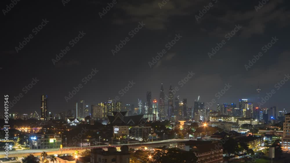 Aerial view hyperlapse 4k video of Kuala Lumpur city center view during earth hour night overlooking the city skyline in Federal Territory, Malaysia. Pan right motion timelapse. Aerial view hyperlapse 4k video of Kuala Lumpur city center view during earth hour night overlooking the city skyline in Federal Territory, Malaysia. Pan right motion timelapse.