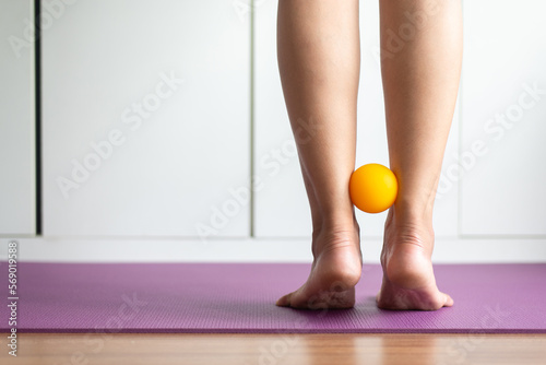 Legs massage acupressure with rubber ball for relieve pain at home