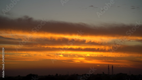 dramatic Red clouds and sunray for pattern background. A burning sky in a horror movie. crimson storm in apocalyptic, judgment day. © Govind