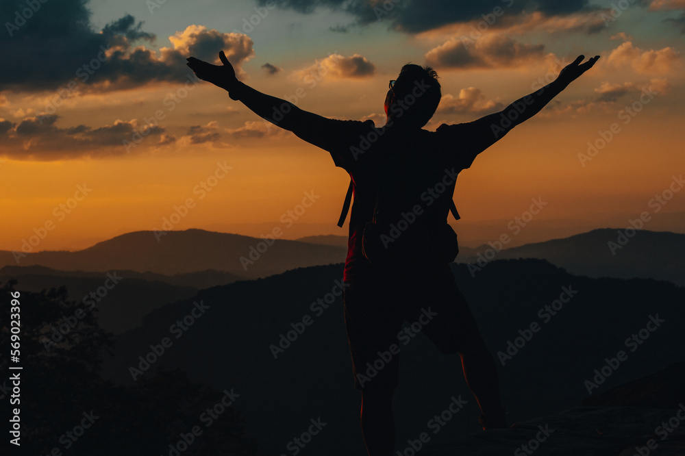 silhouette achievements successful arm up man is on top of hill celebrating success with sunset