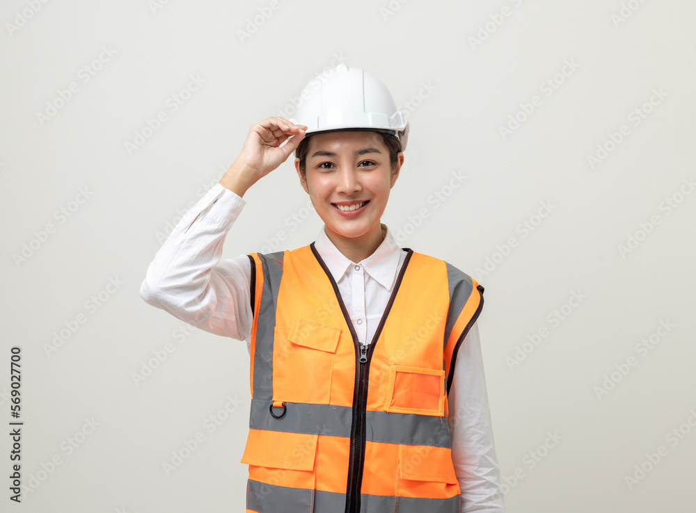 Asian engineer worker woman or architect with white safety helmet standing on isolated white background. Mechanic service factory Professional work job occupation in uniform.