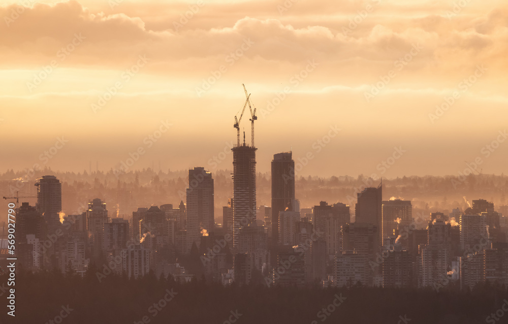 Constructino Site in Modern Downtown City of Vancouver, British Columbia, Canada. Golden Winter Sunrise Sky.