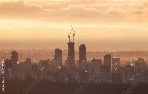 Constructino Site in Modern Downtown City of Vancouver  British Columbia  Canada. Golden Winter Sunrise Sky.