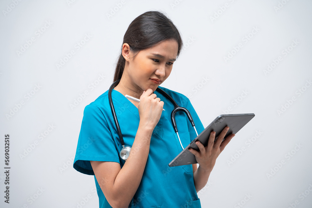 Portrait of Asian female doctor standing with stethoscope using digital tablet isolated on white background. Portrait of Asian female doctor standing with stethoscope using digital tablet isolated on white background.