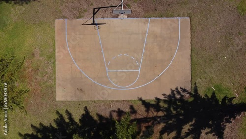 Top down aerial view of rural basketball half court in Australian countryside photo