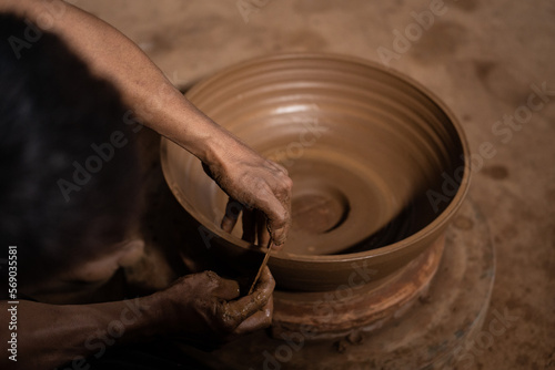 The process of forming traditional pottery crafts, located in Kasongan, Yogyakarta, Indonesia photo