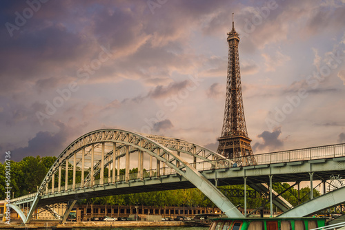 Debilly Footbridge and Eiffel Tower at riverbank of Seine in Paris, France