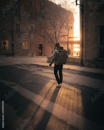 man standing in front of golden light
