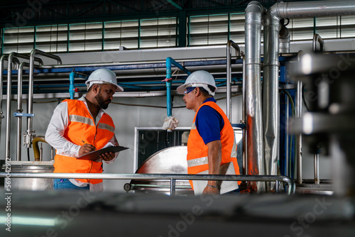 industrial worker Talking to a plant engineer about safety