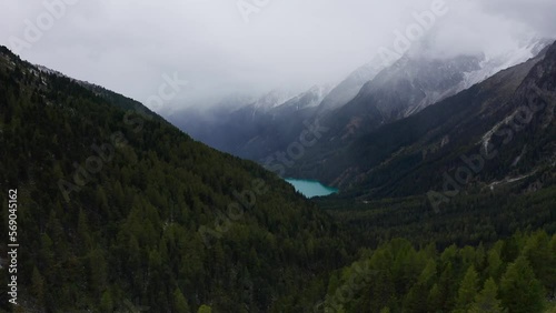 Wallpaper Mural Stunning and cinematic aerial video of mountains, vegetation, frozen peaks and lake.  Torontodigital.ca