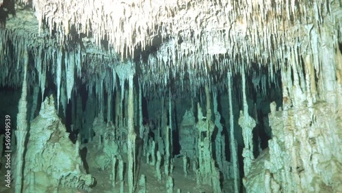 Underwater stalactites in the cenotes in caves of Mexico. Diving in the cenotes.