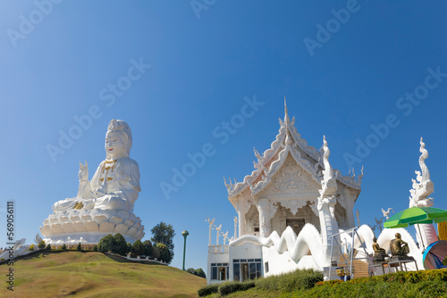 Big White Guan Yin Statue and White Dragon at Wat Huay Pla Kang Buddhist Temple. Landmark of Chiang Rai.