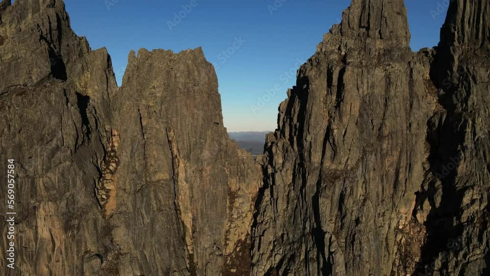 Aerial view showing gigantic Molladalen Mountains against blue sky at sunset in Norway Aerial view showing gigantic Molladalen Mountains against blue sky at sunset in Norway
