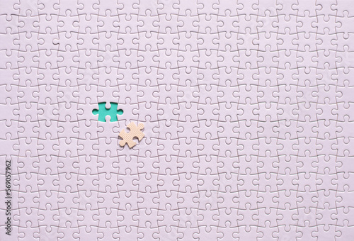 Jigsaw puzzle white color,Puzzle pieces grid,Success mosaic solution template,Horizontal on green background copy space for text,Top view