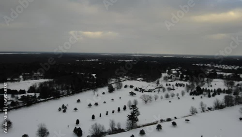 A golf course covered in a blanket of snow in the middle of Winter. photo